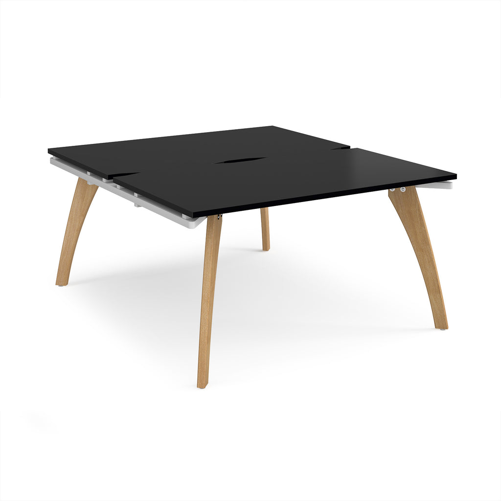 Wooden back-to-back desk with black top on a white background