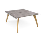Wooden back-to-back desk with grey top on a white background