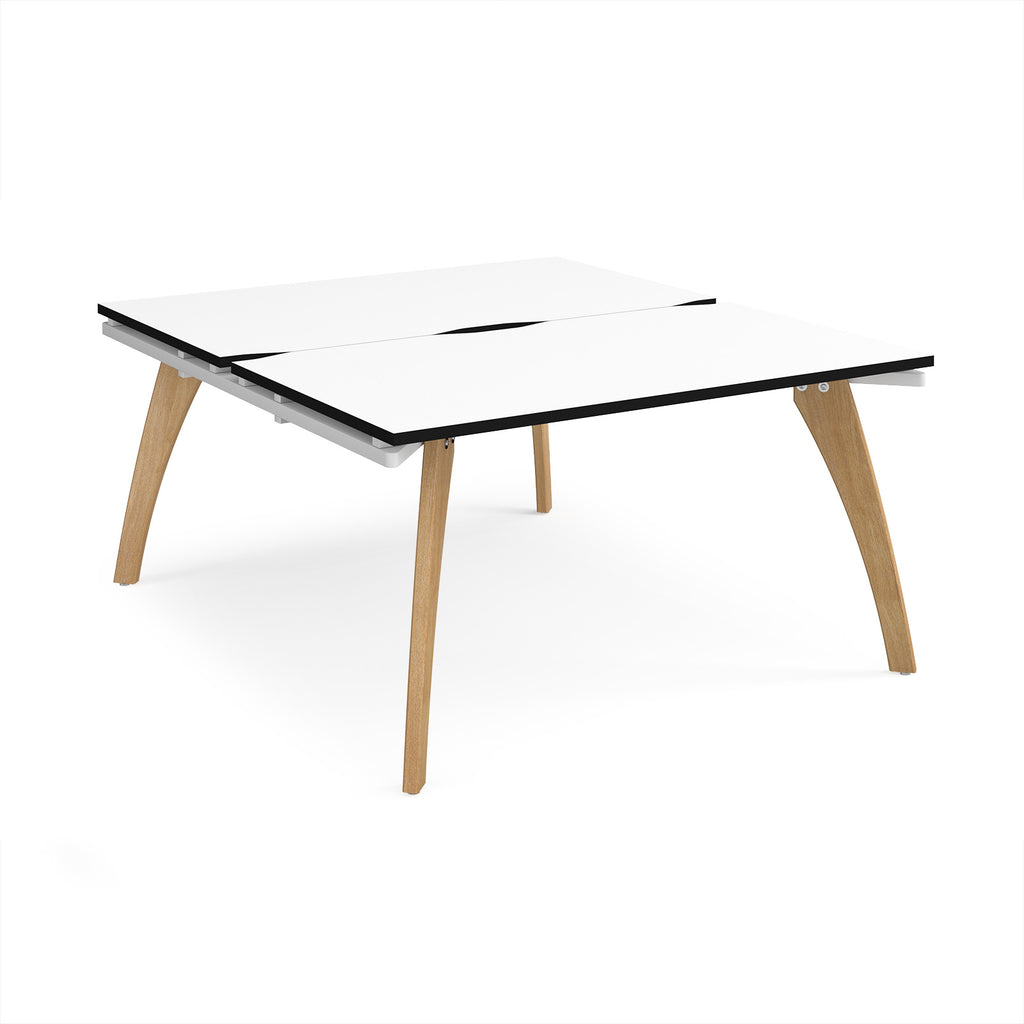 Wooden back-to-back desk with white top with black edge on a white background