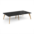 Wooden back-to-back desk with black top on a white background
