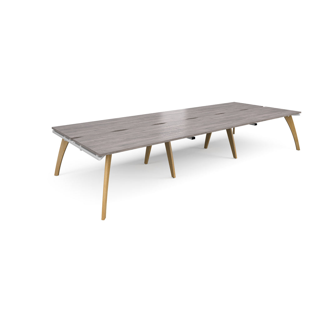Long back-to-back wooden desk with grey top on a white background