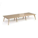 Long back-to-back wooden desk on a white background