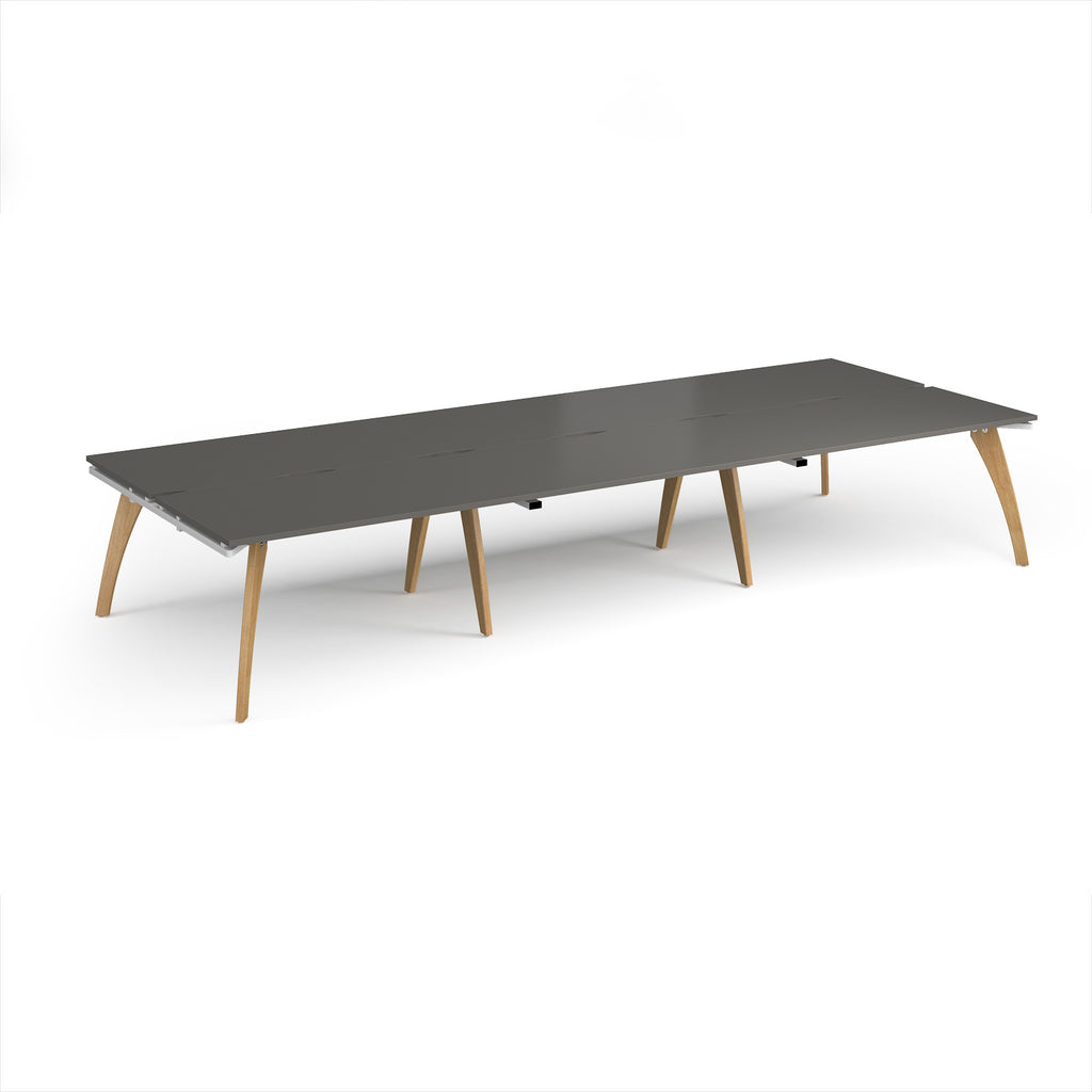 Long back-to-back wooden desk with grey top on a white background