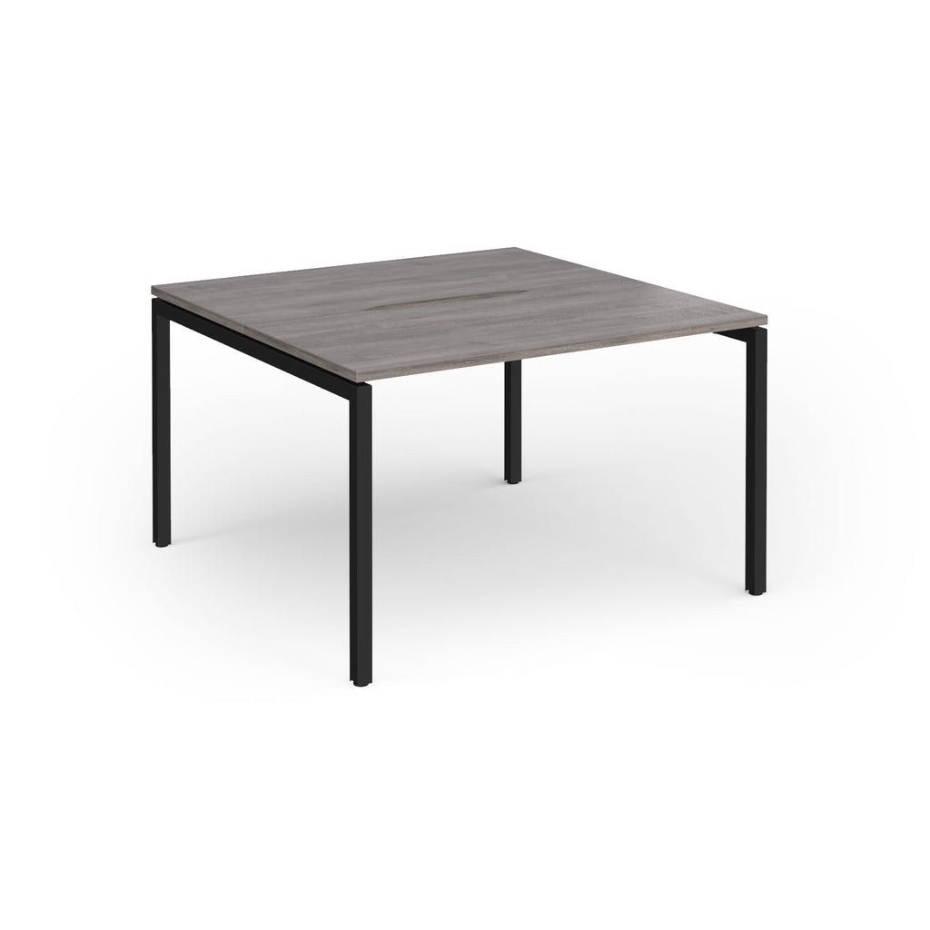 Back-to-back desk with grey wood-effect top and black metal frame on a white background