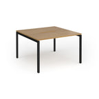 Back-to-back desk with wood-effect top and black metal frame on a white background