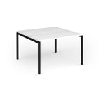 Back-to-back desk with white top and black metal frame on a white background