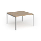 Back-to-back desk with wood-effect top and silver metal frame on a white background