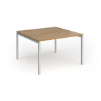 Back-to-back desk with wood-effect top and silver metal frame on a white background