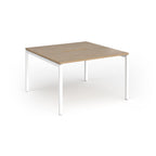 Back-to-back desk with wood-effect top and white metal frame on a white background