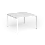 Back-to-back desk with white top and metal frame on a white background