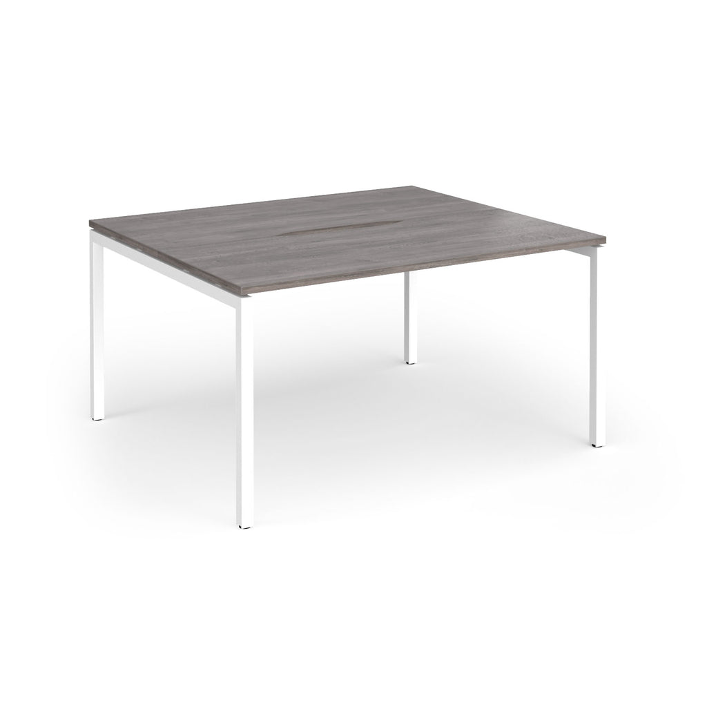 Back-to-back desk with grey wood-effect top and white metal frame on a white background