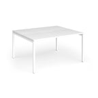 Back-to-back desk with white top and metal frame on a white background