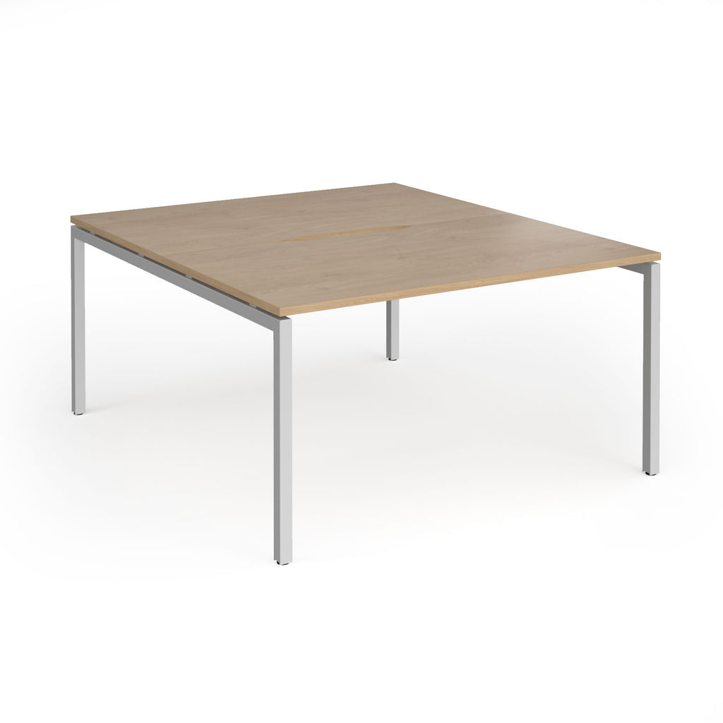 Office back-to-ack desk with wood-effect top and silver metal frame on a white background