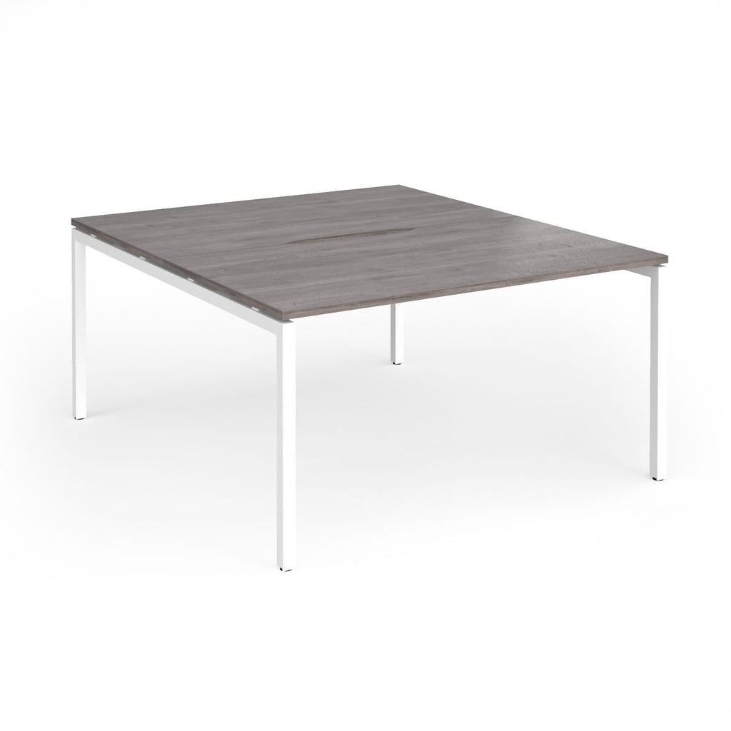 Office back-to-ack desk with grey wood-effect top and white metal frame on a white background