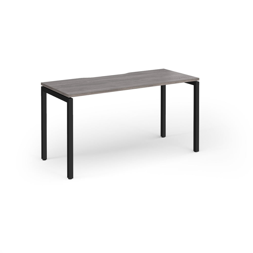 Rectangular desk with grey wood-effect top and black legs on a white background