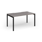 Rectangular desk with grey wood-effect top and black frame on a white background