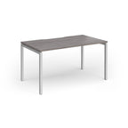 Rectangular desk with grey wood-effect top and silver frame on a white background