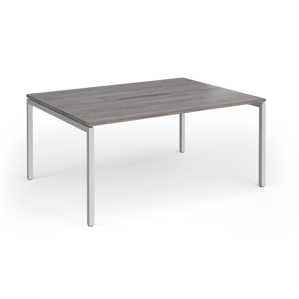 Back-to-back desk with grey wood-effect top and silver metal frame on a white background