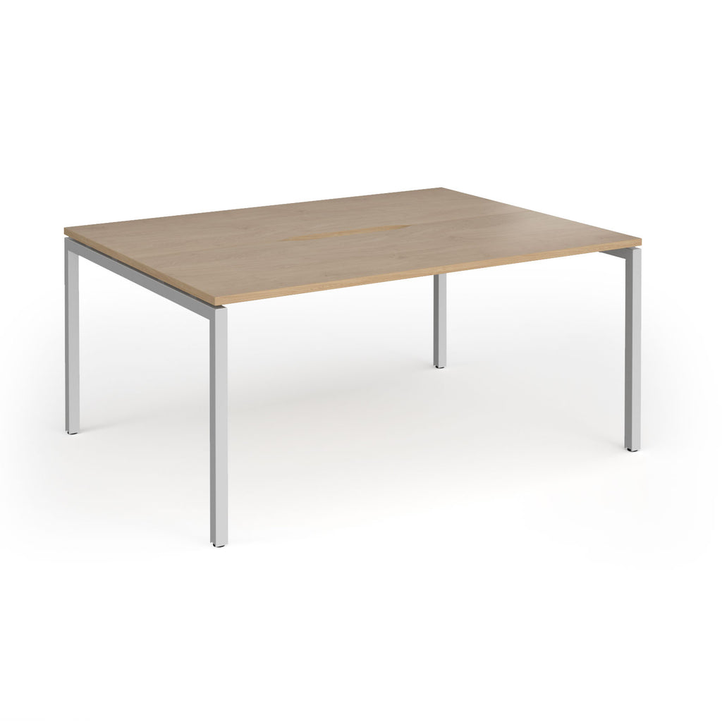 Back-to-back desk with wood-effect top and silver metal frame on a white background