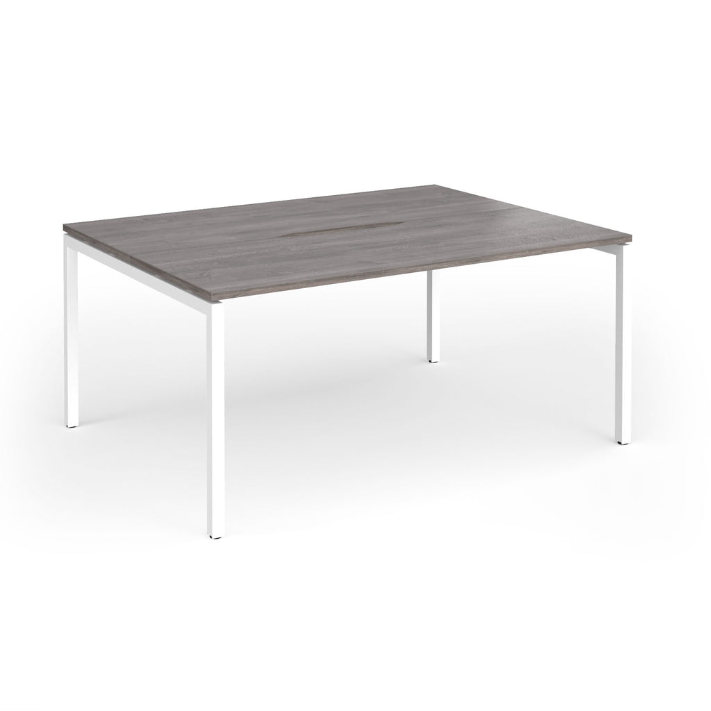 Back-to-back desk with grey wood-effect top and white metal frame on a white background