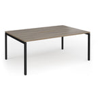 Back-to-back desk with wood-effect top and black metal frame on a white background