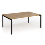 Back-to-back desk with wood-effect top and black metal frame on a white background