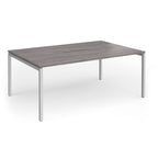 Back-to-back desk with grey wood-effect top and silver metal frame on a white background
