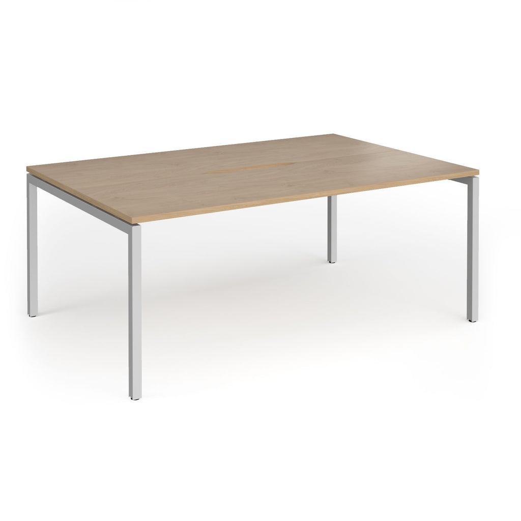 Back-to-back desk with wood-effect top and silver metal frame on a white background