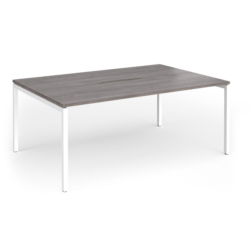 Back-to-back desk with grey wood-effect top and white metal frame on a white background