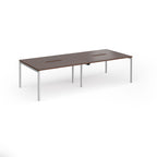 Office bench desks with wood-effect top and silver legs on a white background