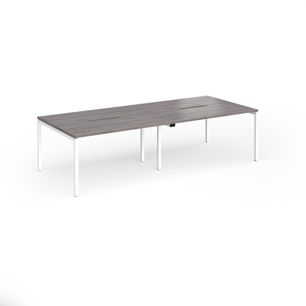 Office bench desks with grey wood-effect top and white legs on a white background