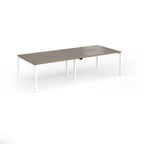 Office bench desks with wood-effect top and white legs on a white background