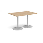 A rectangular table with a light wood-effect top and two silver pedestal bases, shown on a plain white background.