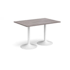 A rectangular table with a grey wood-effect top and two white pedestal bases, shown on a plain white background.