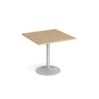 A modern square dining table with a wood-effect top and a silver pedestal base, shown on a plain white background.