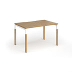 Straight desk with light oak wood grain top and legs with white frame on a white background