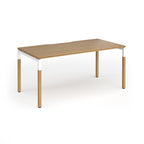 Straight desk with light oak wood grain top and legs with white frame on a white background