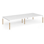 Double back to back desk with white top and wooden legs on a white background