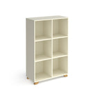 A modern 6-compartment cube storage shelf in a warm off-white finish with small natural wood feet, shown on a plain white background.