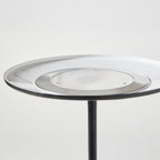 Round lamp with a black metal base on a white background