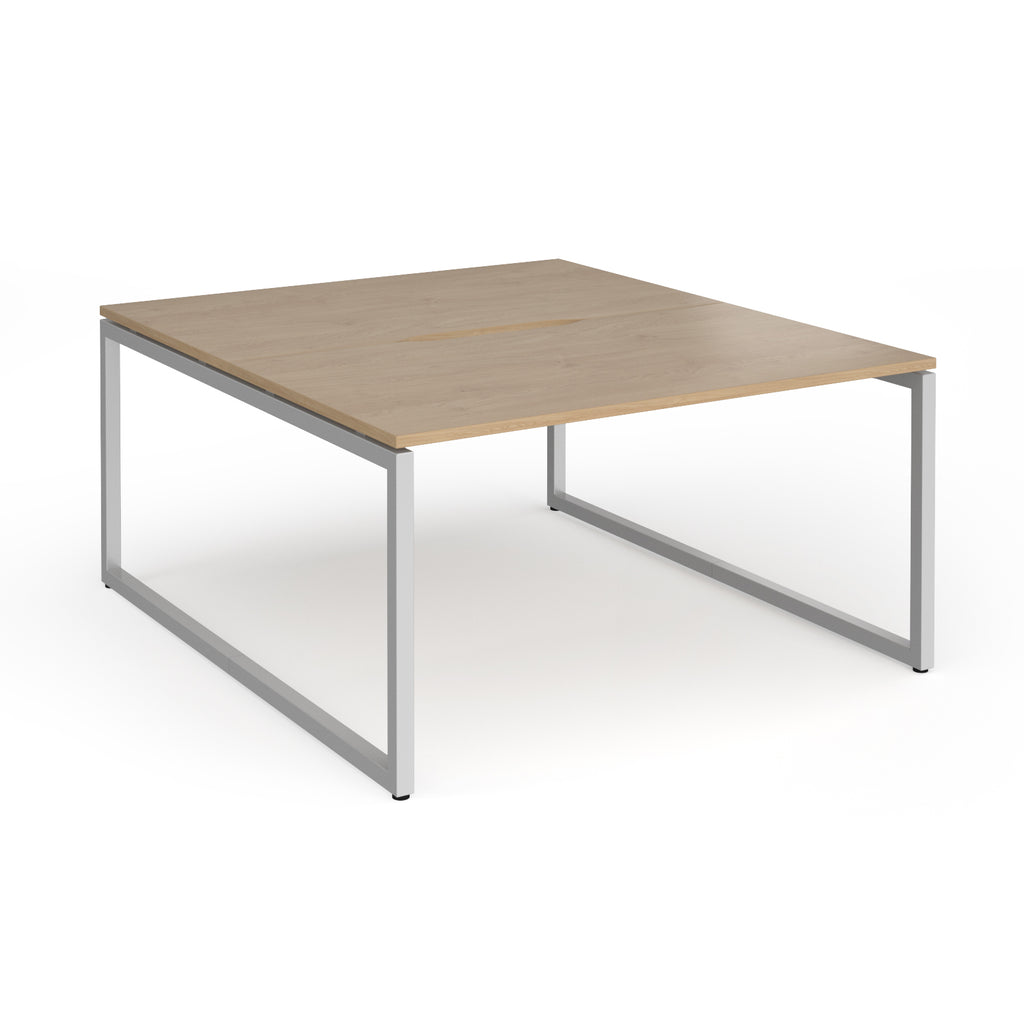 Back-to-back desk with wood-effect top and silver metal legs on a white background