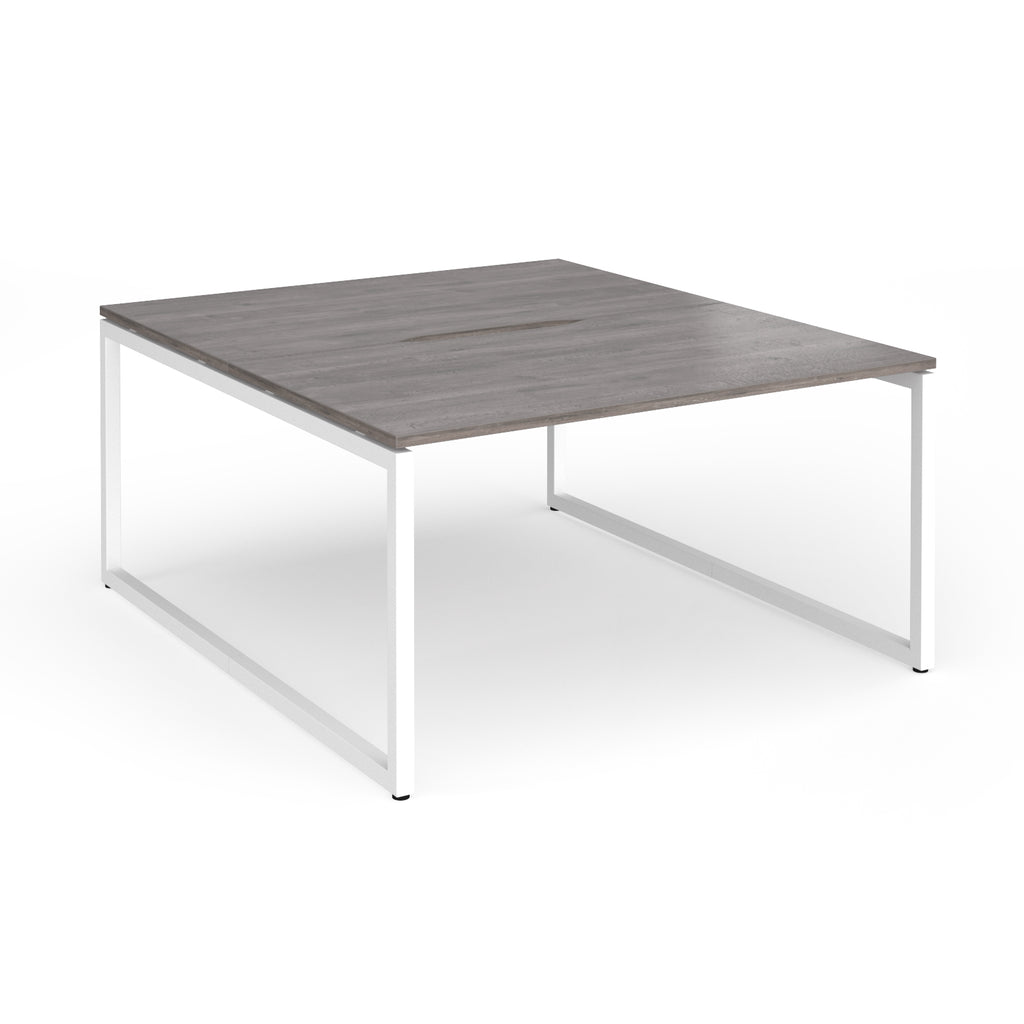 Back-to-back desk with grey wood-effect top and white metal legs on a white background