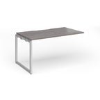 Desk add-on with grey wood-effect top and silver metal frame on a white background