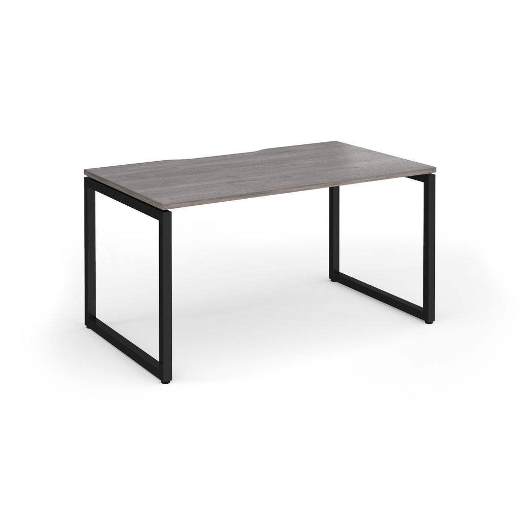 Rectangular desk with grey wood-effect top and black metal legs on a white background
