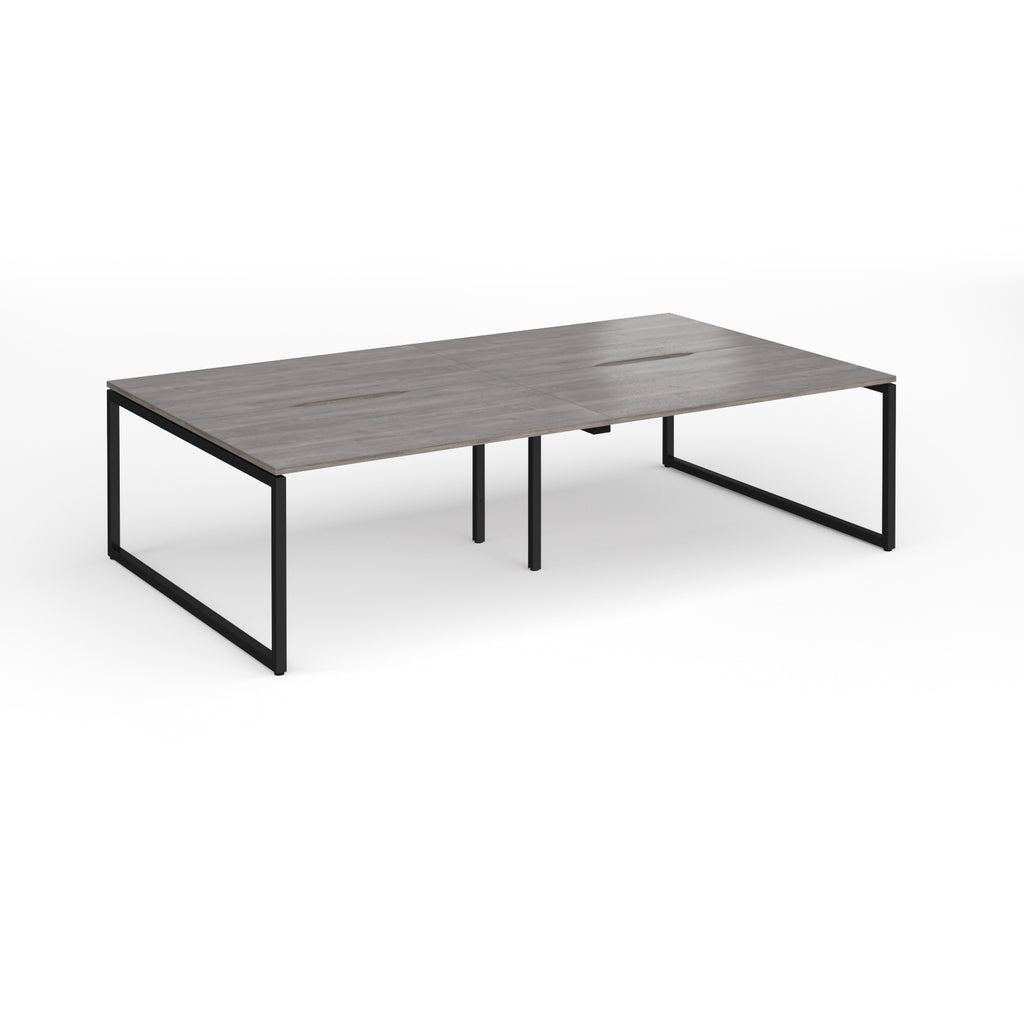 Back-to-back bench desk with grey wood-effect top and black metal legs on a white background