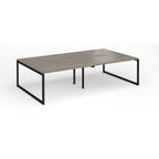 Back-to-back bench desk with wood-effect top and black metal legs on a white background