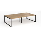 Back-to-back bench desk with wood-effect top and black metal legs on a white background
