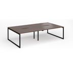 Back-to-back bench desk with wood-effect top and black metal legs on a white background