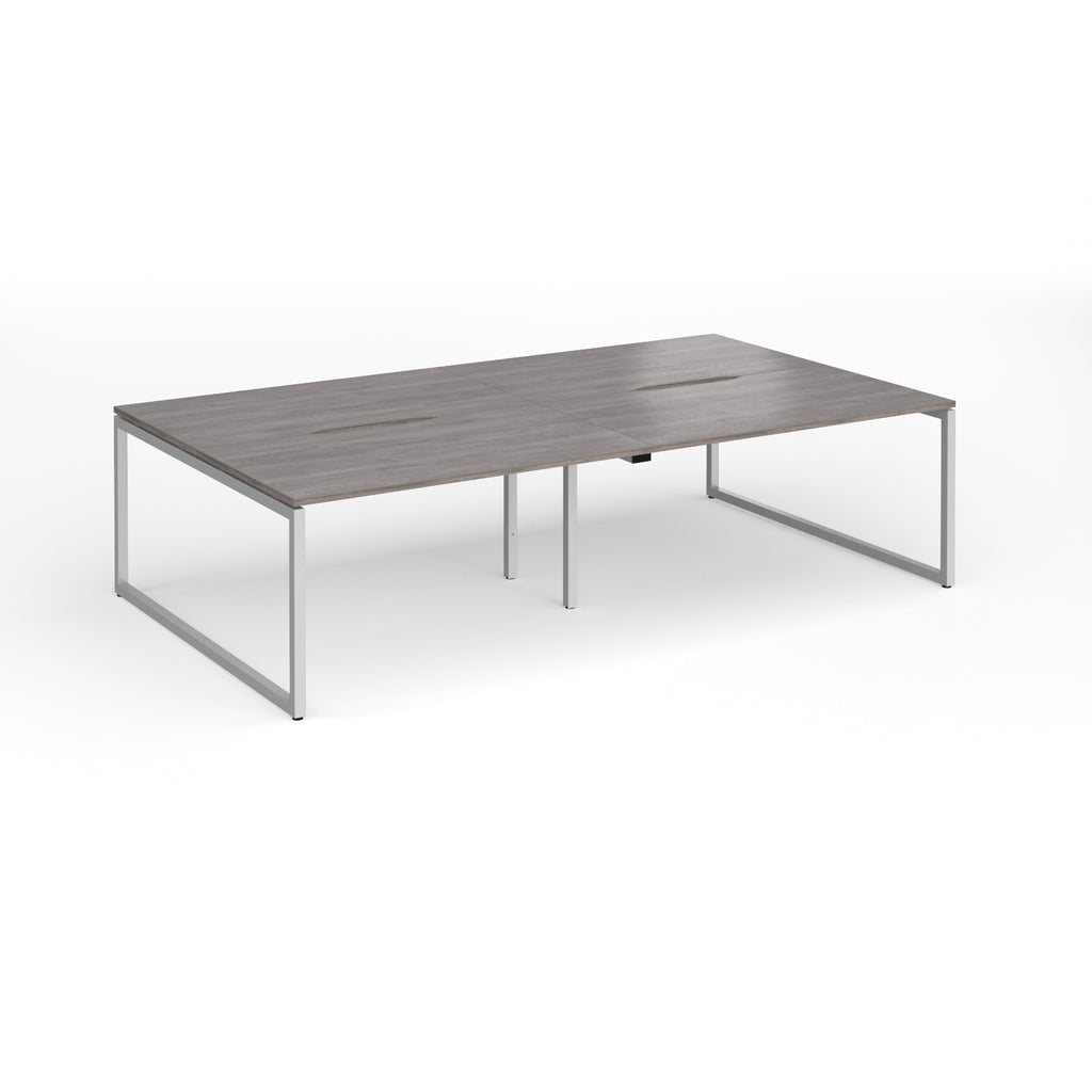 Back-to-back bench desk with grey wood-effect top and silver metal legs on a white background