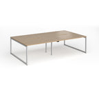 Back-to-back bench desk with wood-effect top and silver metal legs on a white background